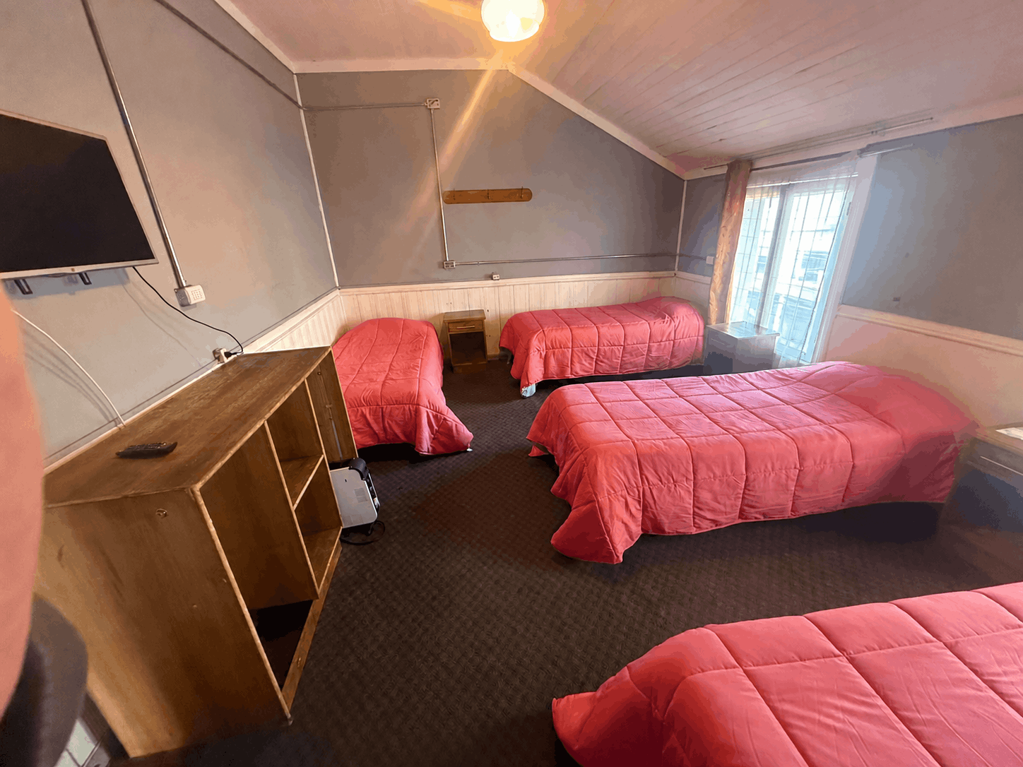 Habitación cuádruple con cuatro camas en Hostal Papo, Osorno